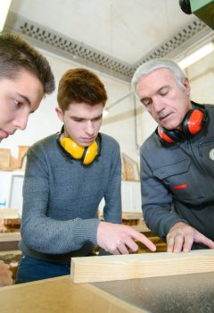 Male students in a woodwork class